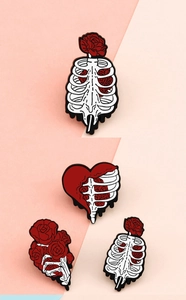 Detailed skull and red rose alloy pins showing artistic skeleton rib cage designs
