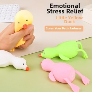 Detail view of colorful duck squeeze toys showing soft texture and squeezing action