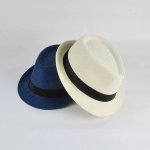 Detail of woven straw fedora hats in navy and beige with black silk bands and breathable texture