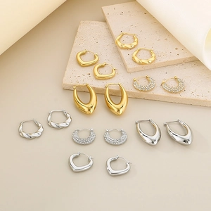 Minimalist U-shaped geometric hollow earrings in polished gold and silver steel finish