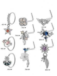 Detailed view of nine titanium steel nose studs with colorful zircon heart and leaf designs