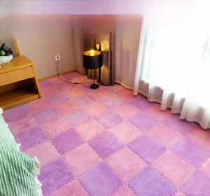 Detail of pink and purple plush interlocking foam floor mats in bedroom