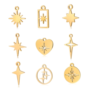Macro detail of various gold stainless steel star and heart charms for DIY jewelry making
