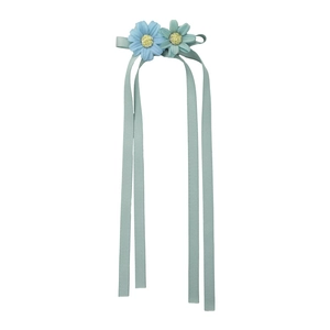 Sweet daisy flower hair clip with light blue and green petals and soft silk ribbons