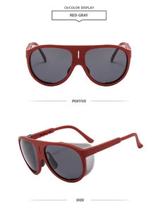 Close-up of red oversized aviator sunglasses with gray lenses from front and side views
