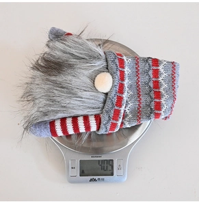 Detailed view of knitted Christmas gnome wine cover weighing approximately 40.5 grams