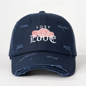 Distressed navy baseball cap with pink rose embroidery and LOST LOVE artistic text