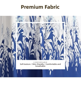 Detail view of floral print fabric featuring blue sunflowers on soft white material