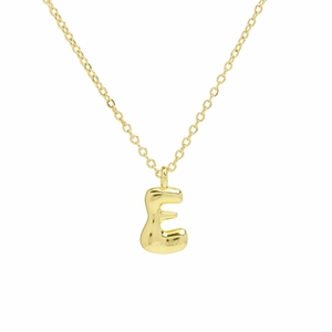 Macro view of polished 18k gold plated bubble letter E pendant on a thin link chain