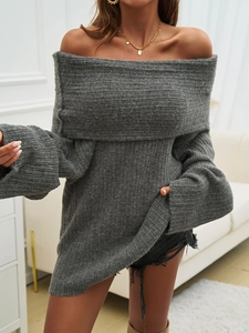 Detail view of a loose-fitting grey off-shoulder knitted sweater for women with long sleeves