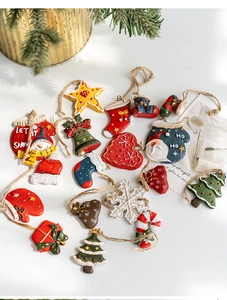 Detailed flat lay of festive resin Christmas tree ornaments with colorful holiday shapes