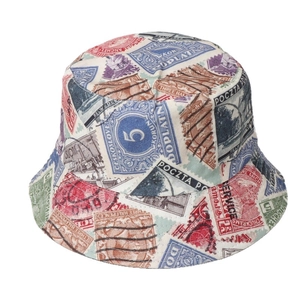 Reversible bucket hat featuring vintage stamp prints in retro colors on canvas fabric