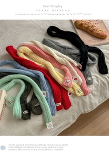 Close-up of colorful knit scarves collection with woven label and premium soft texture