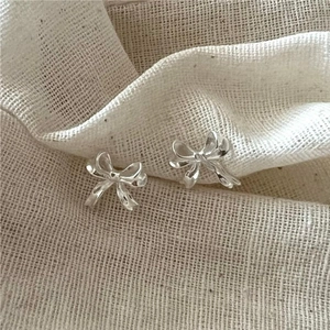 Elegant 925 sterling silver bow knot stud earrings for women with polished finish