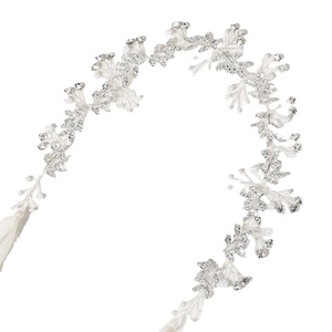 Detailed close-up of crystal leaf bridal headband with white pearls and silver wire