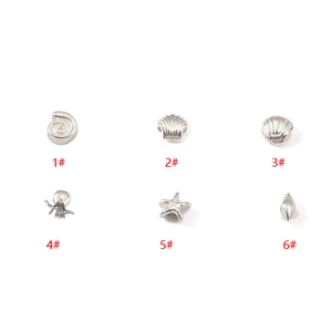 Set of 6 silver stainless steel ocean charms including starfish, octopus, and seashells