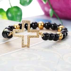 Stainless steel beaded bracelet featuring a gold cross pendant with cubic zirconia stones