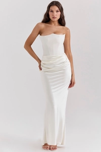 Detail of elegant white off-shoulder satin gown showing corset structure and draped folds
