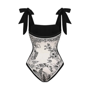 Costume da bagno intero color crema con stampa floreale nera e spalline a fiocco