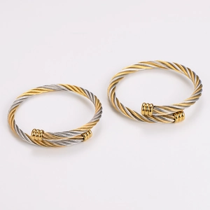 Exquisite twisted cable cuff bracelet in two-tone gold and silver minimalist metal style