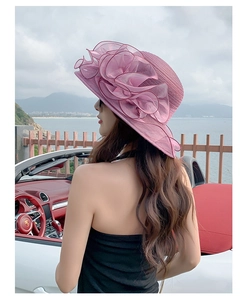 Detailed back view of a purple organza sun hat with a large floral decoration