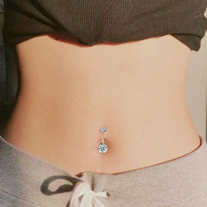 Silver F136 titanium belly button ring with sparkling round cubic zirconia on a model