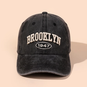 Close-up of vintage washed cotton baseball cap with Brooklyn 1947 3D embroidery detail
