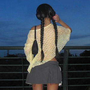 Detailed back view of yellow lace off-shoulder top and charcoal grey pleated mini skirt
