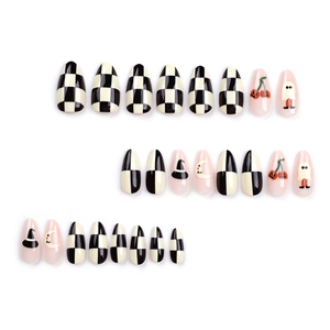 Halloween almond press-on nails with checkerboard, pumpkin, and ghost designs
