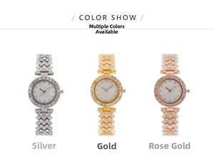 Detailed view of silver, gold, and rose gold crystal-encrusted watches with shell dials