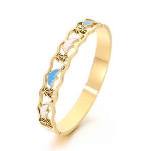 Gold stainless steel ocean bracelet with blue dolphin and coconut tree enamel details