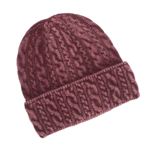 Detail of burgundy cable knit beanie showing thick warm fabric and ribbed cuff texture