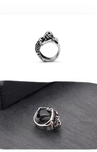 Macro shot of vintage stainless steel skull ring with dark punk aesthetic details