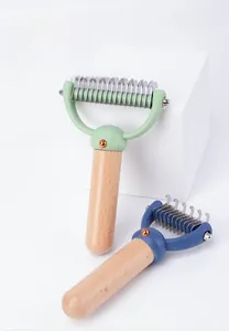 Close-up of beech wood handle pet grooming rake with stainless steel de-matting teeth