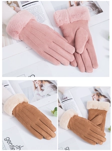 Pink and tan faux suede winter gloves with plush cuffs on a magazine background