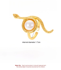 Detailed view of golden snake ring with pearl inlay showing 1.7cm diameter size info