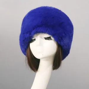 Close-up of royal blue faux fur hat showing thick texture on a head mannequin