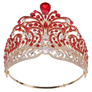 Detailed close-up of a luxury gold crown featuring intricate red and white rhinestones