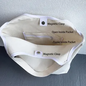 White canvas tote bag featuring magnetic closure and inner zipper pocket storage