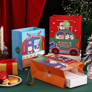 Three colorful Christmas gift bags with nylon handles on festive holiday background