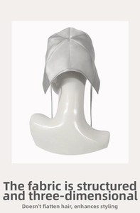 Macro detail of silver silk sun hat with structured fabric and long ribbons