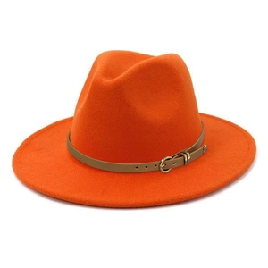 Detail view of bright orange fedora hat featuring a slim brown leather belt and gold buckle