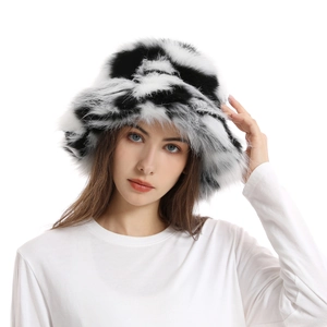 Close-up of black and white faux fur bucket hat with camouflage pattern texture