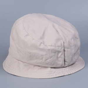 Detailed view of beige washed cotton bucket hat with parallel stitched brim reinforcement