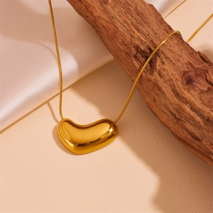 18k gold plated stainless steel snake chain necklace with a 3D heart pendant on silk cloth