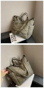 Detail of olive green quilted tote bag showing diamond stitching and side pocket