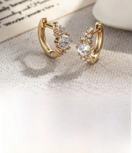 Macro shot of 9mm gold hoop earrings with zircon pavé and detailed measurements