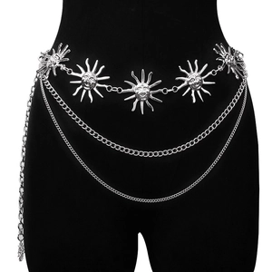 Detail of silver sun face metal waist chain with layered tassels on black mannequin