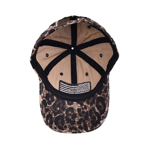Detailed view of leopard print baseball cap featuring interior American flag patch