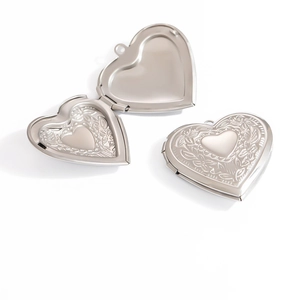 Detailed view of heart locket pendant in mirror polished finish with open and closed states